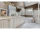Bright bathroom featuring dual sinks, granite countertops, a soaking tub, and a separate shower at 81502 Alexander, Chapel Hill, NC 27517