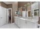 Elegant bathroom with dual sinks, granite countertops, custom cabinets, and updated fixtures at 81502 Alexander, Chapel Hill, NC 27517
