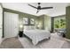 Inviting bedroom with a comfortable bed, ceiling fan, and bright windows overlooking the yard at 81502 Alexander, Chapel Hill, NC 27517
