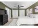 Well-lit bedroom with a ceiling fan, neutral colors, and a plush bed with large closets at 81502 Alexander, Chapel Hill, NC 27517
