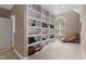 Spacious closet with custom built-in shelving, natural light, and room for storage and display at 81502 Alexander, Chapel Hill, NC 27517