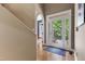 Inviting foyer features hardwood floors, arched doorway, and a large front door with glass panels at 81502 Alexander, Chapel Hill, NC 27517