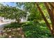 Charming home with landscaped front yard, curved driveway, and a well-manicured lawn with flowers at 81502 Alexander, Chapel Hill, NC 27517