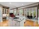 Open kitchen with stainless appliances, granite counters, and hardwood floors at 81502 Alexander, Chapel Hill, NC 27517