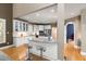 Spacious white kitchen features a granite island, stainless steel appliances, and hardwood floors at 81502 Alexander, Chapel Hill, NC 27517