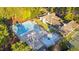 Aerial view of a community pool, clubhouse, and recreational amenities offers resort-style living at 81502 Alexander, Chapel Hill, NC 27517