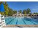 Resort-style swimming pool with ample seating and lush landscaping, perfect for relaxation and recreation at 81502 Alexander, Chapel Hill, NC 27517