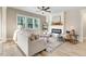 Bright living room with fireplace, ceiling fan, hardwood floors, and an abundance of natural light at 9314 Turkey Way, Middlesex, NC 27557