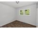 This bedroom features hardwood-style floors with a great natural light source at 995 Shawtown Rd, Lillington, NC 27546