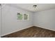 This bedroom features hardwood-style floors with a great natural light source at 995 Shawtown Rd, Lillington, NC 27546