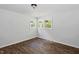This bedroom features a hardwood-style floor with great natural light at 995 Shawtown Rd, Lillington, NC 27546