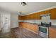 A bright kitchen with wooden cabinets and stainless steel appliances, offering a functional and appealing space at 995 Shawtown Rd, Lillington, NC 27546