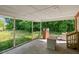 Large covered patio featuring concrete flooring and views of the surrounding yard at 995 Shawtown Rd, Lillington, NC 27546