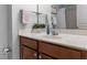 Well-maintained bathroom with a warm vanity, modern fixtures, and ample counter space at 100 Stratford Lakes Dr # 361, Durham, NC 27713