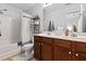Bathroom featuring a double vanity, a large mirror, and a shower-tub combo for added convenience at 100 Stratford Lakes Dr # 361, Durham, NC 27713
