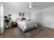 Comfortable bedroom with neutral walls, soft carpet, ceiling fan, and a stylish decorative area rug at 100 Stratford Lakes Dr # 361, Durham, NC 27713