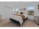 Bright bedroom featuring neutral decor, plush carpet, and ample natural light at 100 Stratford Lakes Dr # 361, Durham, NC 27713