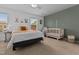 Bedroom or room offering a neutral color scheme, a crib, and a comfortable seating area by the window at 100 Stratford Lakes Dr # 361, Durham, NC 27713