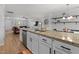 Modern kitchen featuring granite countertops, stainless steel appliances, and a breakfast bar open to the living room at 100 Stratford Lakes Dr # 361, Durham, NC 27713