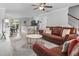 Open-concept living room featuring hardwood floors and modern décor flowing into the dining and kitchen areas at 100 Stratford Lakes Dr # 361, Durham, NC 27713