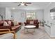Living room featuring leather sofas, a patterned rug, and view of front entry at 100 Stratford Lakes Dr # 361, Durham, NC 27713