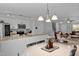 Open concept living area seamlessly connects the kitchen with the dining and living room spaces at 100 Stratford Lakes Dr # 361, Durham, NC 27713