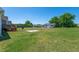 Expansive backyard featuring a wooden deck, shed, and mature trees, ideal for outdoor enjoyment at 104 Jj Dr, Benson, NC 27504