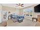 Cozy bedroom with ceiling fan, carpet and bright window at 104 Jj Dr, Benson, NC 27504
