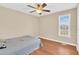 Bright bedroom with hardwood floors and a large window for natural light at 104 Jj Dr, Benson, NC 27504