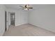 Bedroom featuring neutral carpet, ceiling fan, and closet at 109 Virginia Pl, Cary, NC 27513