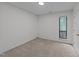 Neutral bedroom with plush carpeting, one window providing natural light, and a closet at 109 Virginia Pl, Cary, NC 27513