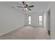Spacious bedroom with neutral carpet, two windows and ceiling fan at 109 Virginia Pl, Cary, NC 27513