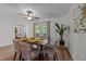 Charming dining space with a table set for four, bathed in light from nearby outdoor access at 109 Virginia Pl, Cary, NC 27513
