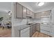 Efficient kitchen with white appliances and white subway tile, perfect for culinary creations at 109 Virginia Pl, Cary, NC 27513