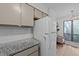 Kitchen with granite countertops, white appliances, and painted cabinets at 109 Virginia Pl, Cary, NC 27513