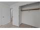 Laundry room area with new white washer, storage shelf, and hardwood-style floors at 109 Virginia Pl, Cary, NC 27513