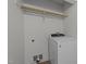 Modern laundry room with front load washer and utility connections, offering convenience at 109 Virginia Pl, Cary, NC 27513