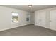 Spacious bedroom with large closets and two windows providing natural light at 111 High Hampton Way, Fuquay Varina, NC 27526