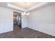 Open-concept dining area with hardwood floors and recessed lighting open to the kitchen at 111 High Hampton Way, Fuquay Varina, NC 27526