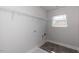 The laundry room has shelving and tile floors with washer and dryer hookups at 111 High Hampton Way, Fuquay Varina, NC 27526