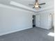 Spacious main bedroom features new carpet, tray ceiling, fan, and plenty of natural light at 111 High Hampton Way, Fuquay Varina, NC 27526