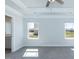 Main bedroom boasts a tray ceiling, fan, neutral colors, new carpet, and natural light at 111 High Hampton Way, Fuquay Varina, NC 27526