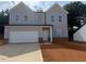 Charming two-story home with gray siding, a two-car garage, and a neatly landscaped front yard at 11121 Salers Loop, Middlesex, NC 27557