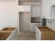 Bright kitchen with white cabinets, ready for appliances, offering a clean and modern design at 11121 Salers Loop, Middlesex, NC 27557