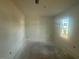 Unfinished room with natural light streaming through the window, offering potential for customization at 11121 Salers Loop, Middlesex, NC 27557