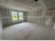 Bedroom under construction with drywall and ample natural light at 11147 Salers Loop, Middlesex, NC 27557