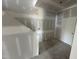 Interior of a new construction room; view of white door with covered walls and floors at 11147 Salers Loop, Middlesex, NC 27557