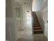 Interior view of a new construction home with wood stairs leading to the second story at 11147 Salers Loop, Middlesex, NC 27557