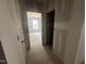 Interior view of a new construction home hallway with doors leading to rooms at 11147 Salers Loop, Middlesex, NC 27557