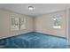 Bedroom features plush carpeting and two windows allowing natural light to fill the room at 1131 Pulley Gordon Rd, Zebulon, NC 27597